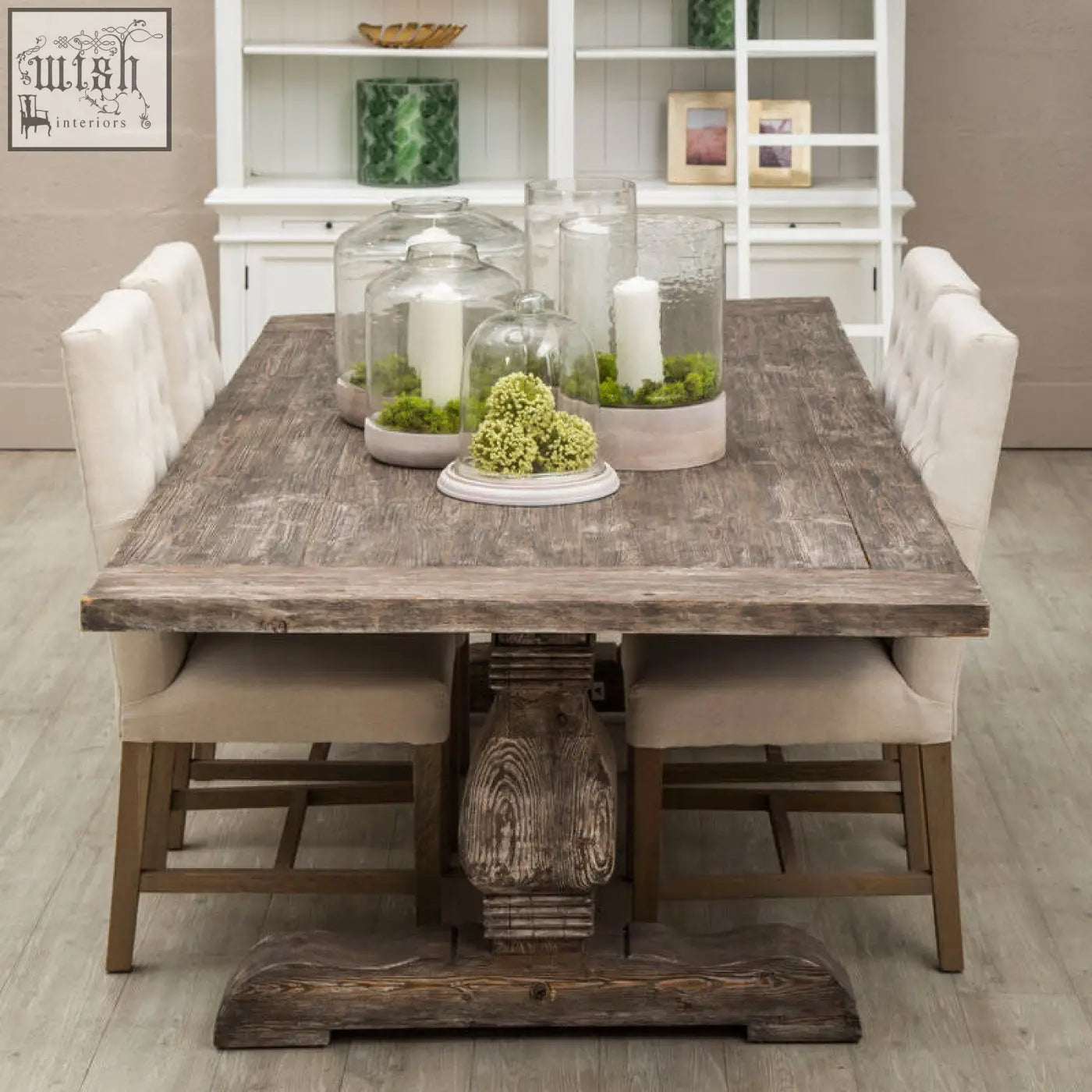 Rustic gray wooden dining table with carved pedestal base and distressed finish made from lovina recycled pine wood