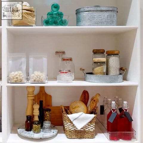 Woven basket holding bread and white cloth next to luca square 1500ml deli jar for stylish food storage