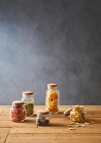 Clear glass luca square 800ml jars with wooden lids filled with colorful pasta varieties for kitchen storage