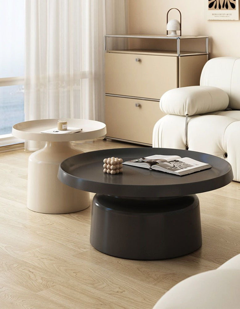 Black matte lucas coffee table with round top thick cylindrical base and raised rim in coffee table set