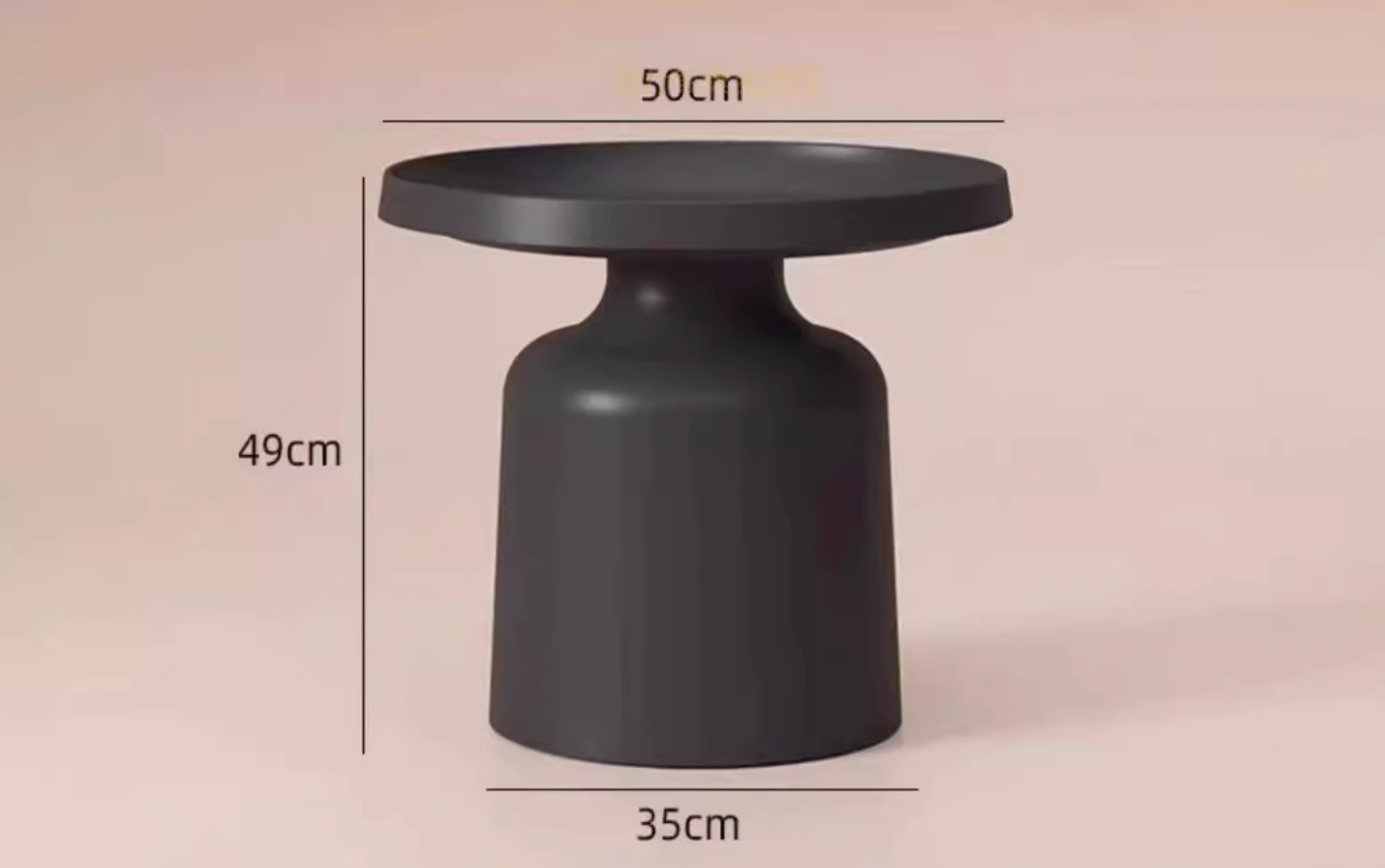 A sleek matte black ceramic coffee table with rounded top and flared base from the lucas coffee table set