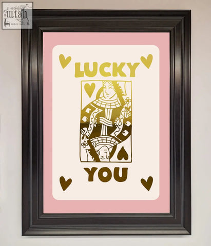 A lucky you foil print featuring a pink queen of hearts card design with gold lettering and fast shipping times