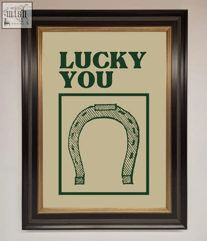 Framed wall art print with a green horseshoe and lucky you text on an off-white background perfect for wall art decor