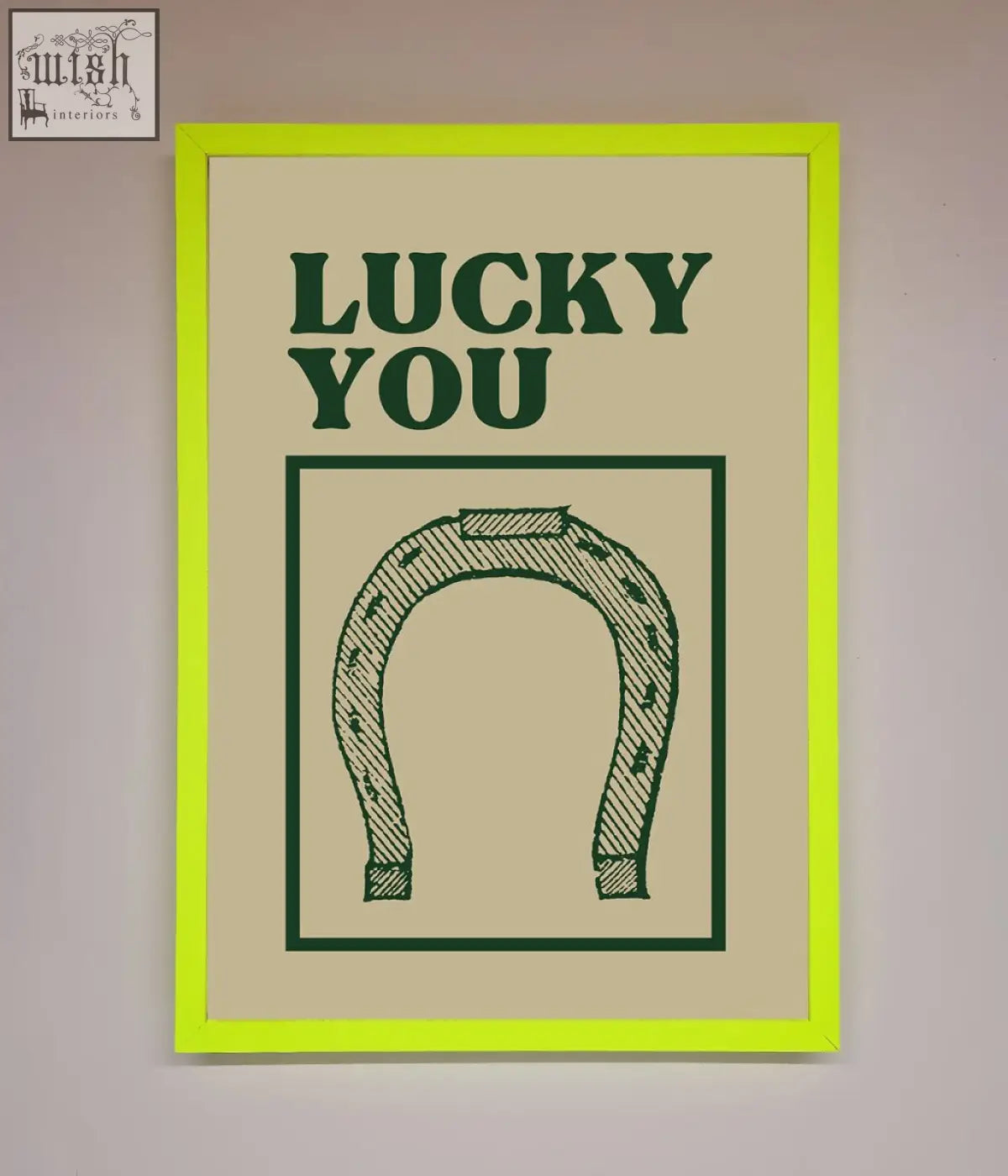 Lucky you framed wall art with neon green border and dark green text featuring a horseshoe illustration