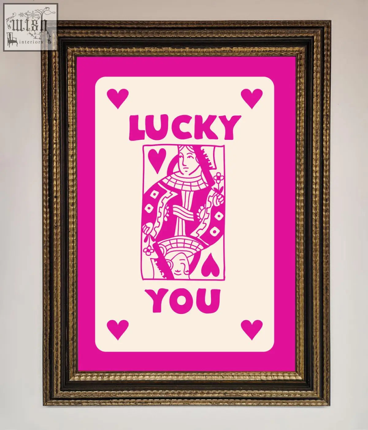 A hot pink framed poster featuring a vibrant pink and cream lucky you queen playing card design on off-white background