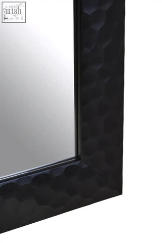 Ludlow wall mirror with black hammered metal frame featuring a textured patterned surface for stylish decor
