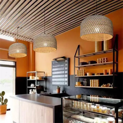 Woven rattan luna light pendant with a warm golden glow perfect for cozy ambient lighting