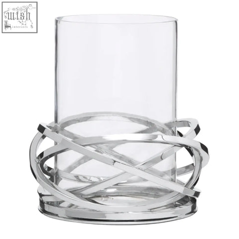 Clear glass candle holder with a sleek interwoven twist small silver finish metal base for elegant decor