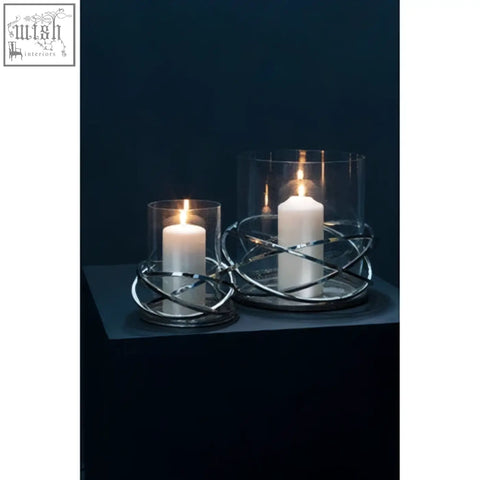 Silver finish twist small silver wire candle holder with clear glass tops holding white pillar candles