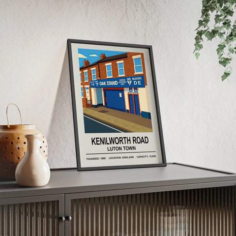 A framed poster print of luton town kenilworth road stadium featuring bold blue and red brickwork design