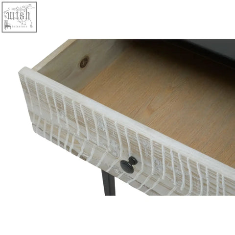 White wicker drawer front with black metal knobs on luxor three drawer rectangular console table