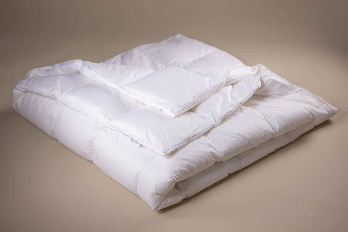 White quilted comforter with soft plush texture made from luxury siberian pure goose down for winter warmth