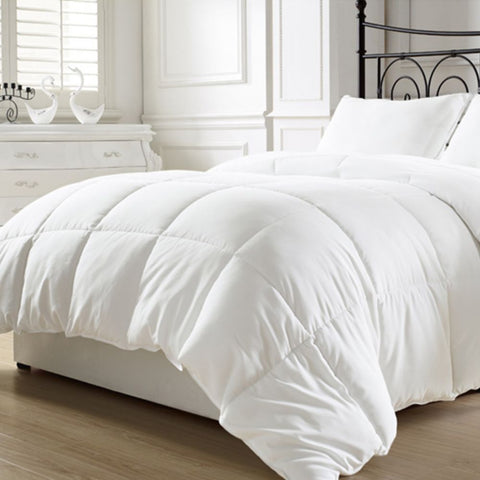 White quilted comforter with plush soft texture and clean lines filled with siberian pure goose down for winter warmth