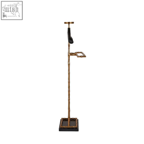 Gold-finished vintage brass coat hanger with leather shoulder pad hook and matching rectangular tray base for suits