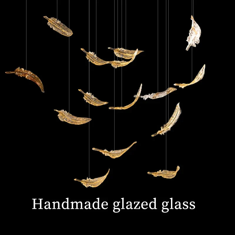 Luxury glass hanging led chandelier with handmade glazed glass panels shaped as gold and silver feathers suspended by wires