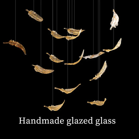 Luxury glass hanging led chandelier with handmade glazed glass panels shaped as gold and silver feathers suspended by wires