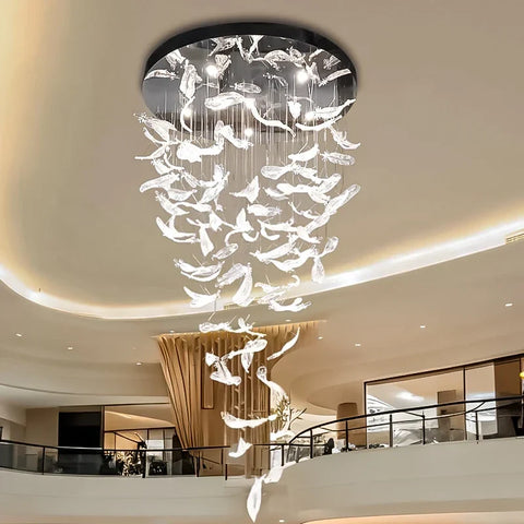 A luxury glass led chandelier with translucent glass feather panels hanging from a black circular ceiling rim