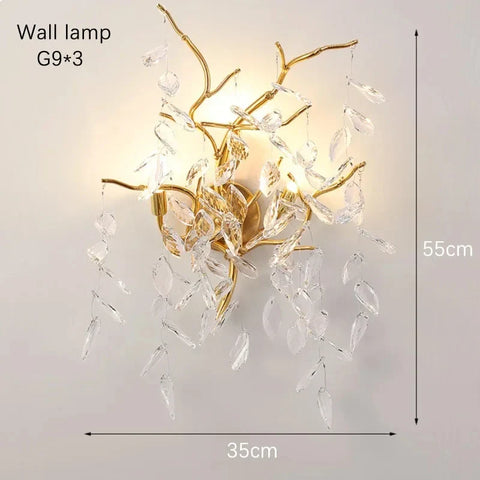Gold-toned branch-style wall lamp with clear crystal leaves perfect as indoor villa lights fixture for elegant villa lights