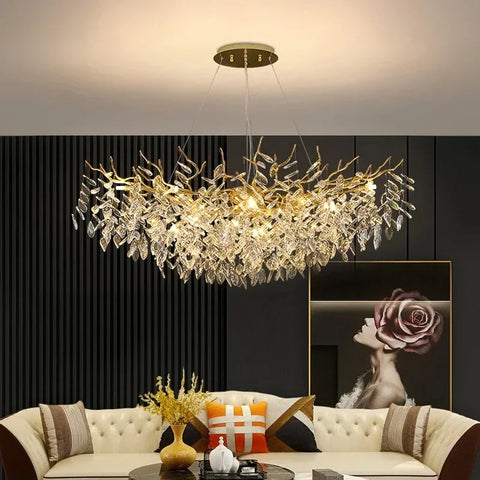 A golden leaf-shaped chandelier with crystal droplets perfect as indoor villa lights fixture for villa lighting