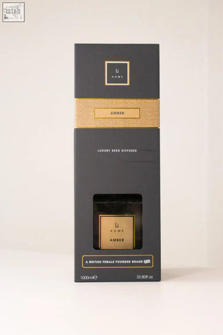 Black and gold luxury square reed diffuser with amber scent in a sleek rectangular box by li home