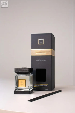 Luxury square diffuser amber reed diffuser set with black and gold design clear glass bottle and dark wood lid