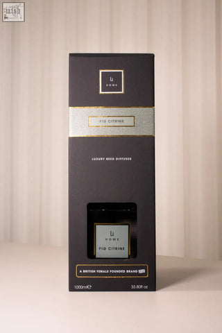 Black rectangular box with luxury square diffuser in fig citrine scent featuring gold foil accents and minimalist branding