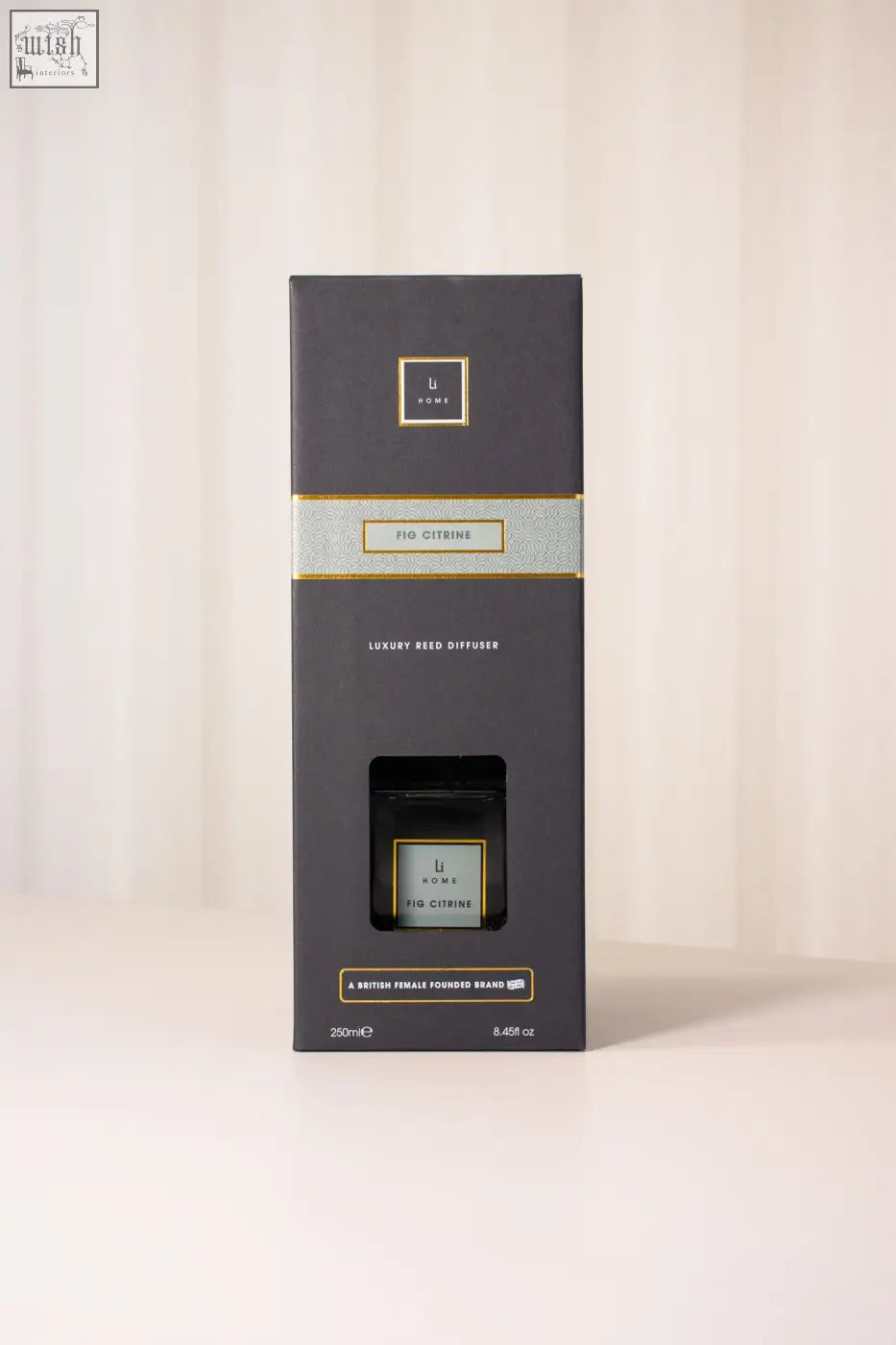 Dark gray rectangular luxury reed diffuser box with gold-trimmed fig citrine label for elegant home scenting