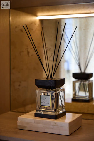 Elegant square glass fig citrine diffuser with black reed sticks and sleek black cap by li nora