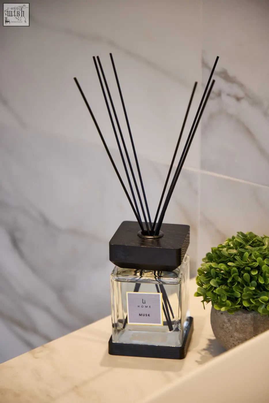 Luxury square diffuser musk with black square base and clear glass bottle labeled li home musk for home fragrance