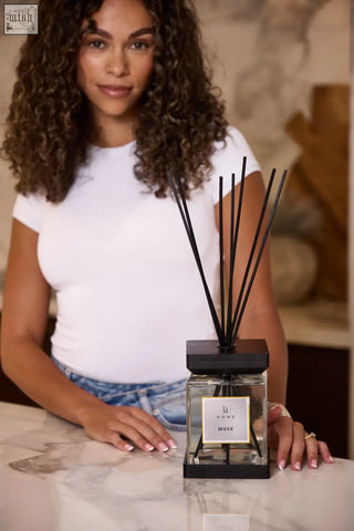 Black-framed glass luxury square diffuser musk with minimalist li home musk label and slender black reeds