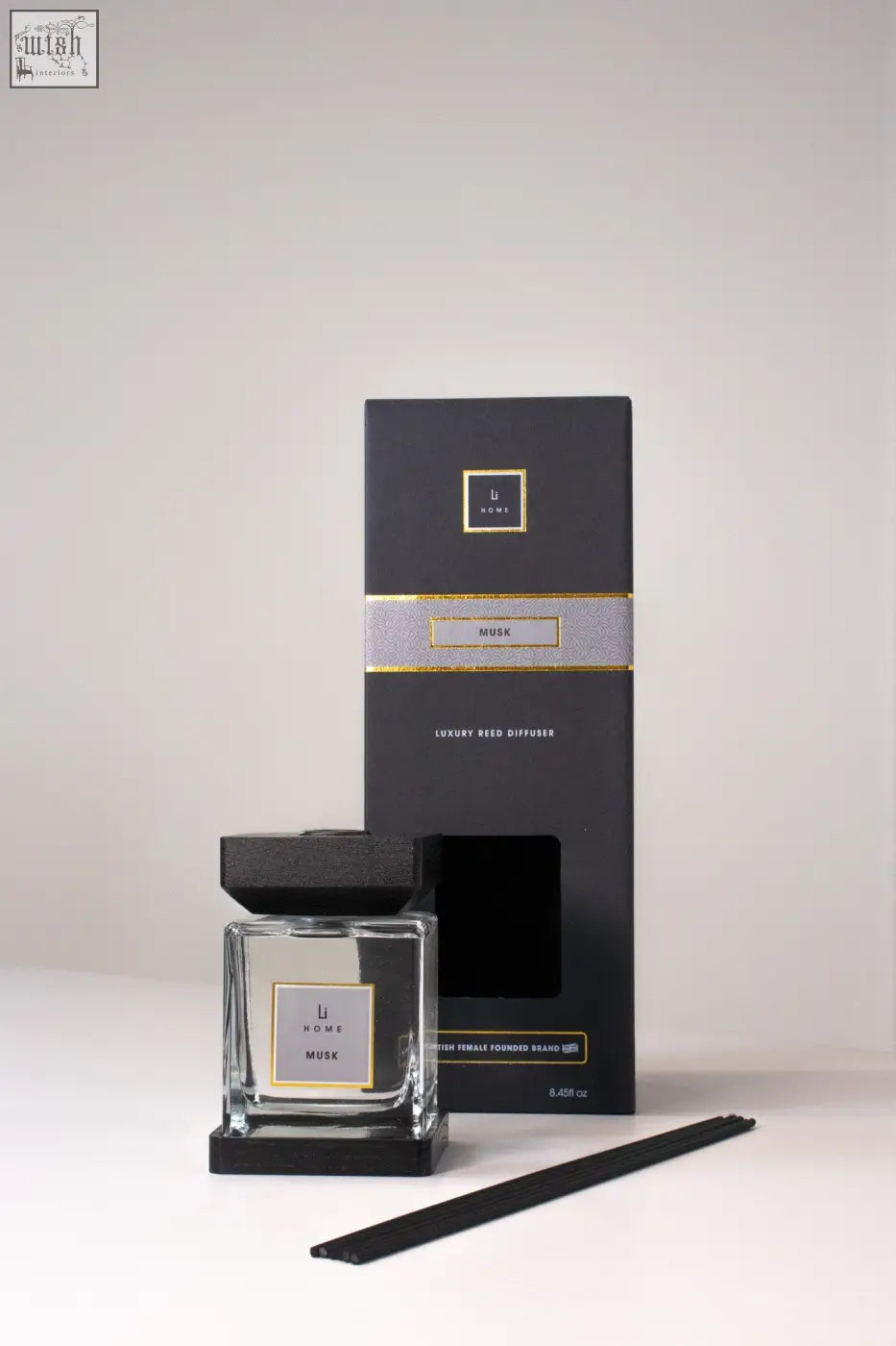 Black glass reed diffuser with sleek square bottle black cap base and gold foil musk branding luxury square diffuser musk