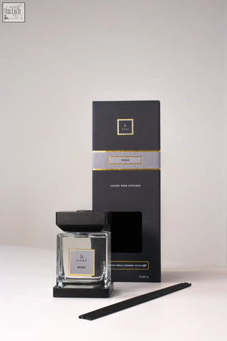 Black glass reed diffuser with sleek square bottle black cap base and gold foil musk branding luxury square diffuser musk