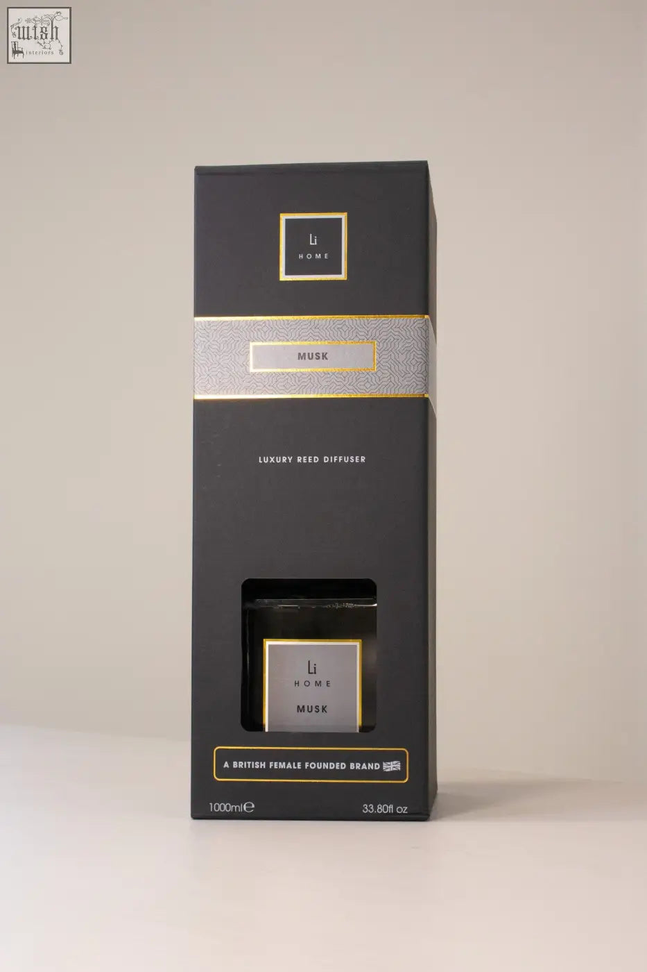 Black rectangular luxury square diffuser with musk scent gold foil accents and minimalist branding on box