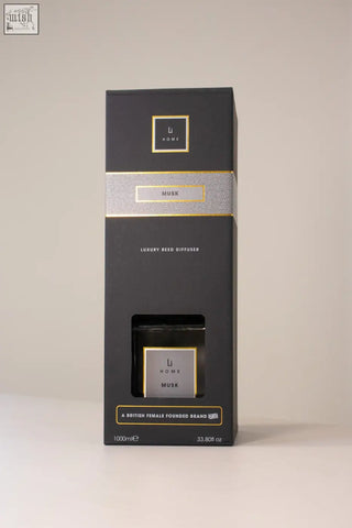 Black rectangular luxury square diffuser with musk scent gold foil accents and minimalist branding on box