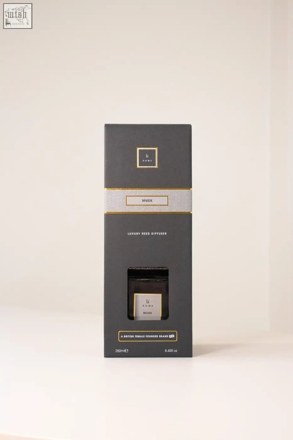 Elegant black rectangular box with luxury musk reed diffuser featuring gold accents and minimalist branding
