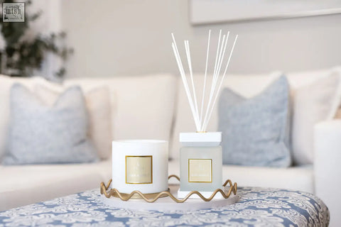White ceramic luxury square diffuser rosa blanco with gold label and slender white reeds scented with white rose