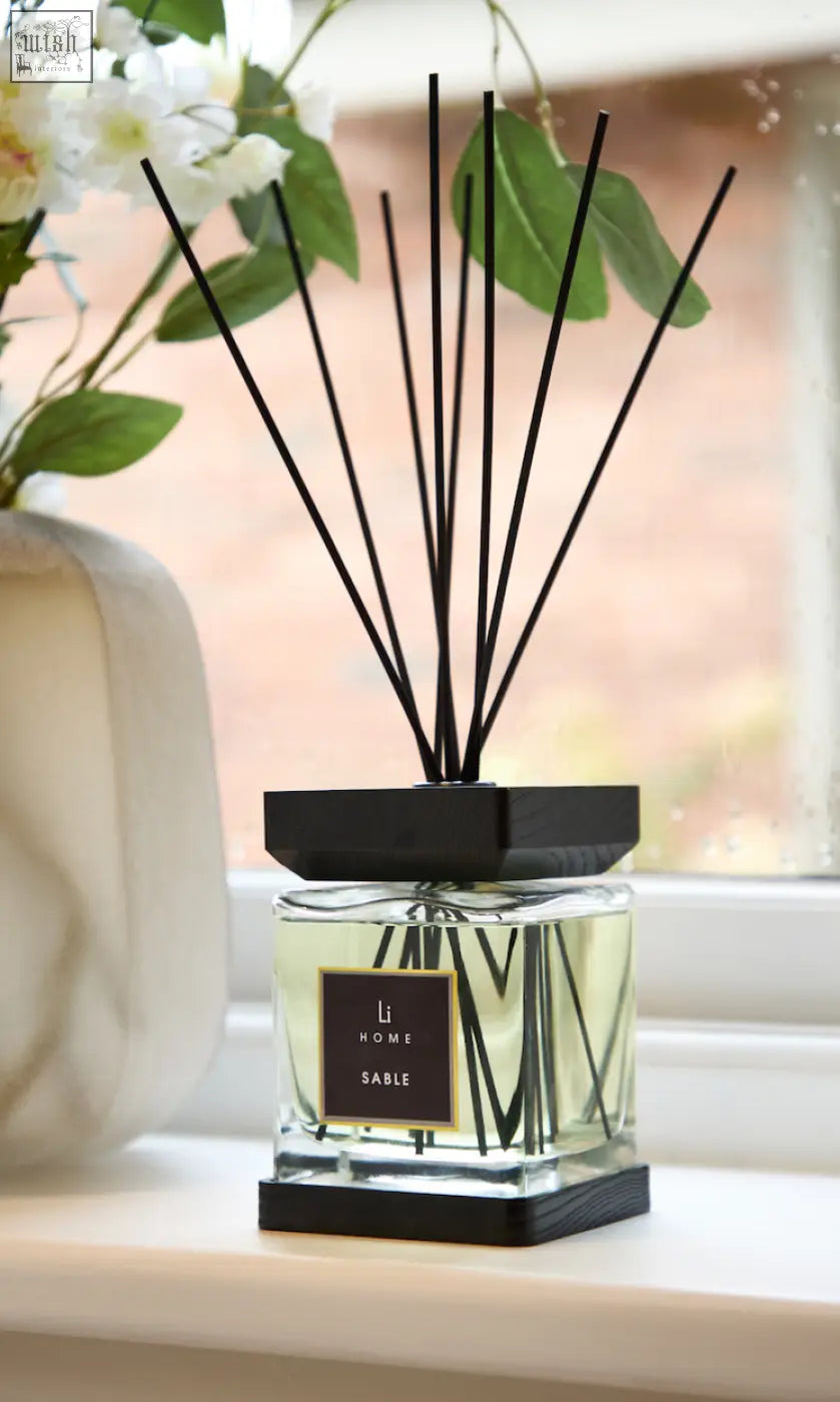 Black-framed glass luxury square diffuser with pale yellow liquid labeled li home sable for home fragrance