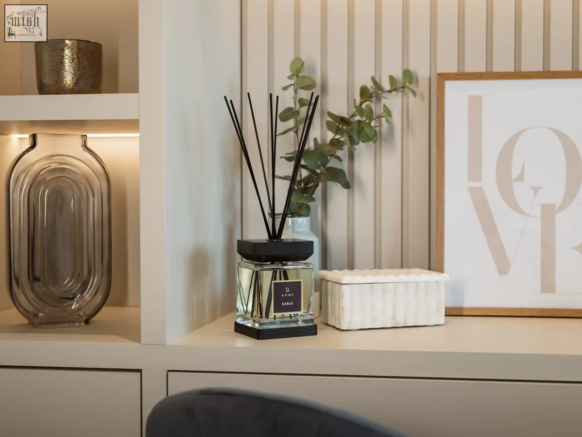 Luxury square diffuser sable with sleek transparent glass, clear liquid, and black lid and base for home fragrance