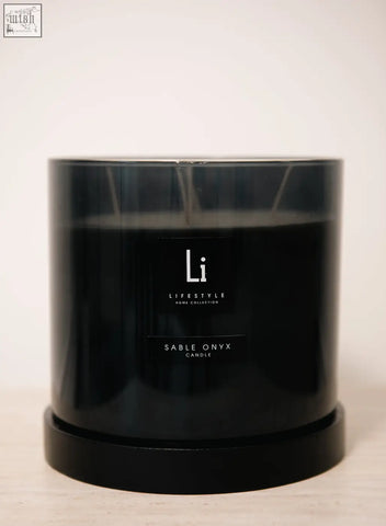 Luxury xxl sable onyx candle in a black glossy container with minimalist white li lifestyle home collection label