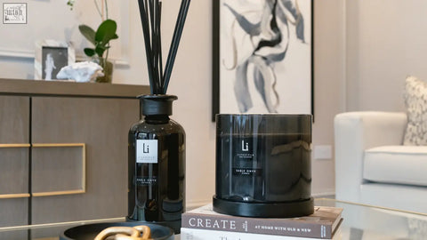 Black glass diffuser with slender reed sticks and minimalist label for luxury sable onyx scent ambiance