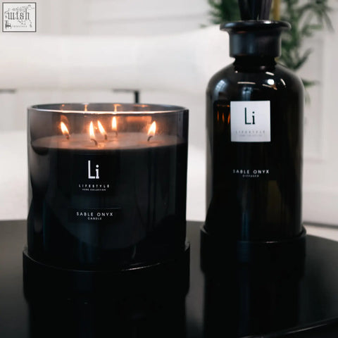 Black glass luxury xxl sable onyx candle with three lit wicks and minimalist white label from li lifestyle home collection