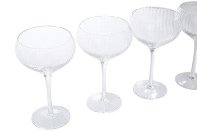 Clear crystal champagne flutes with slender stems in the lyle set of four cocktail glasses perfect for parties