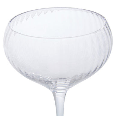 Clear glass coupe from lyle set of four cocktail glasses with fluted rim and textured stem for serving four cocktails
