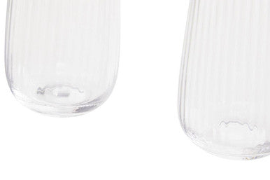 Clear glass salt and pepper shakers with vertical ridges shown alongside lyle set of four hi ball glasses