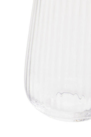 Clear glass vase with vertical ridges and flared base in the lyle set of four hi ball glasses collection