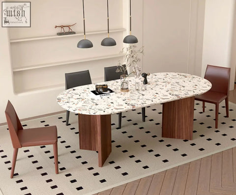 Modern oval lynette dining table with white and black terrazzo top and sleek wooden legs perfect terrazzo dining table