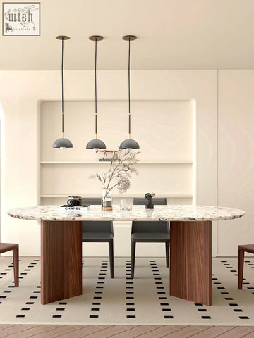 Modern oval lynette dining table with white gray terrazzo marble top and sleek dark wood legs