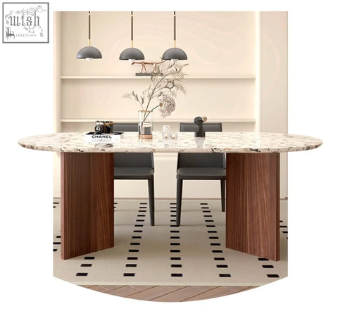 Modern oval lynette dining table with white and gray terrazzo marble top and dark wood legs for stylish dining room