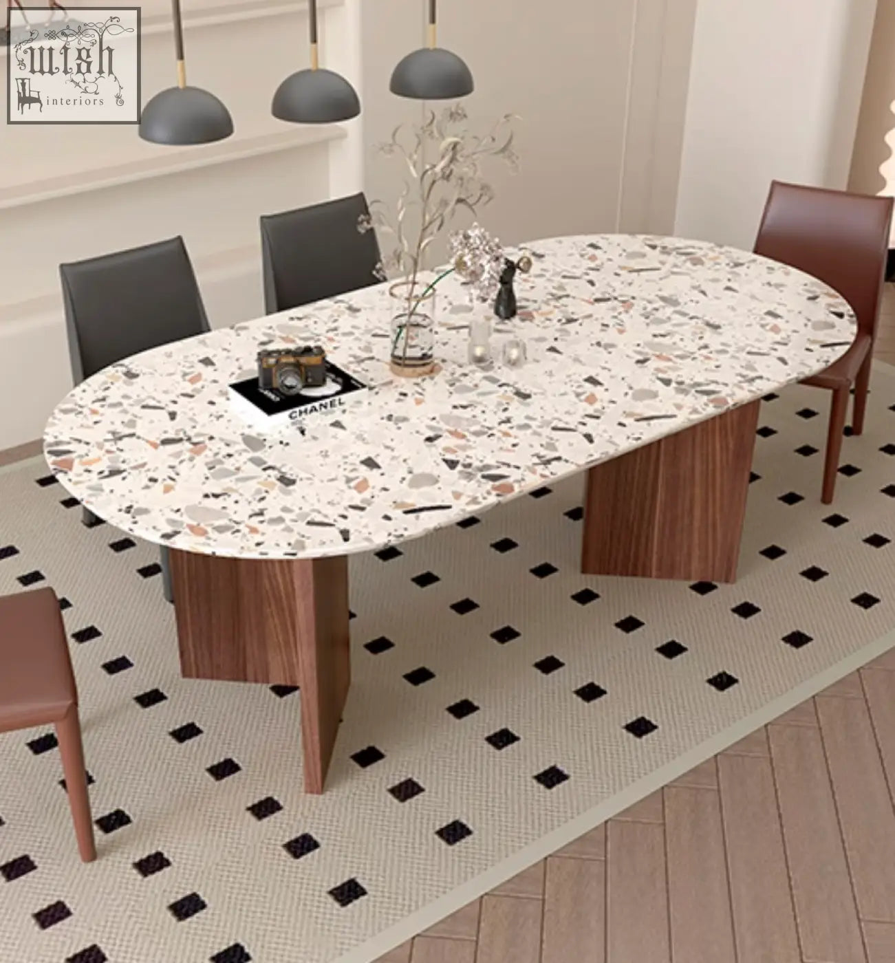Lynette dining table with a white speckled terrazzo oval top and wooden legs perfect as a stylish dining table