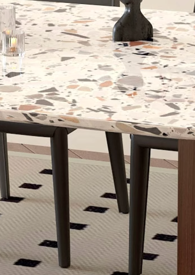 Lynette dining table with terrazzo oval top in white base and speckles of gray beige and muted orange perfect for dining room